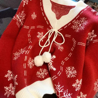 Moteriškas Kalėdinis Megztinis su Snaigių Raštu ir Kaspinu - V Formos Iškirptė